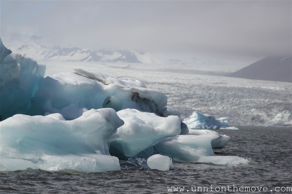Icebergs floating in the Jokulsarlon lagoon with the glacier in the background